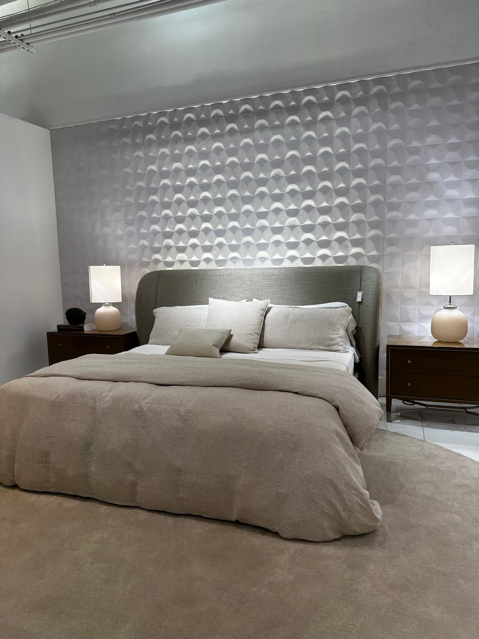 Bedroom with a dimensional feature wall